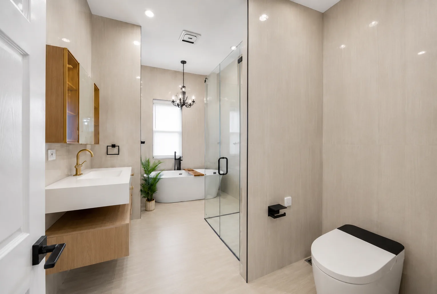 The same bathroom from the doorway, showing the full run of stone and the wall hung fittings