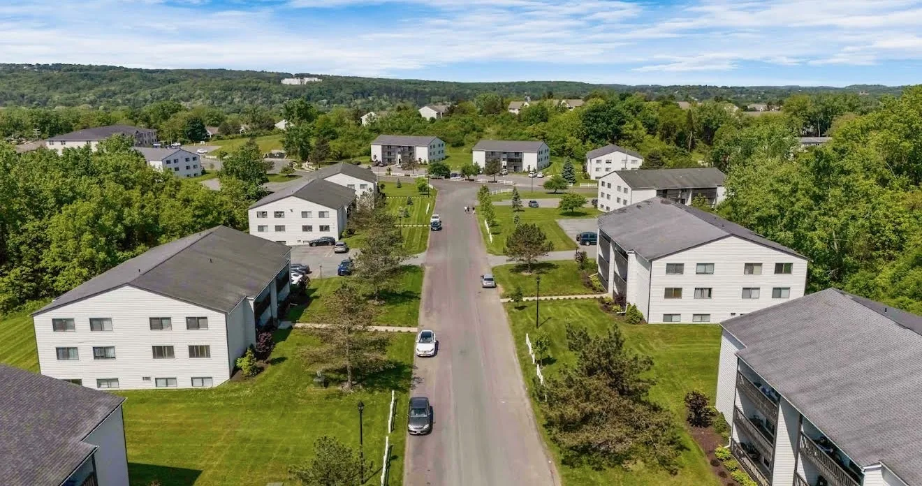 An aerial view along the main drive at Remington Apartments showing the scale of the property